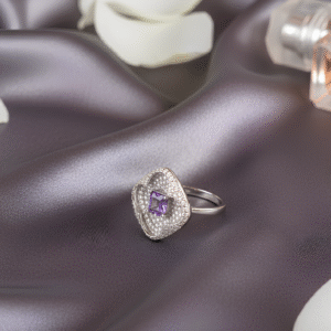 A masterpiece of timeless elegance, the Amara Ring celebrates the essence of Silsilay. Featuring a captivating dusty lavender solitaire at its heart, set in a diamond-studded square frame, this statement piece is your perfect blend of modern design and heirloom charm.