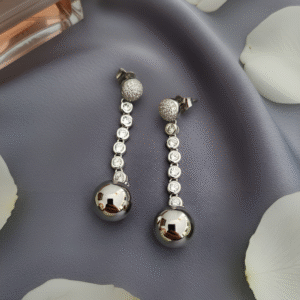 Saima — a line of silver light that ends in a soft pearl glow. Serene, fluid, and exquisitely feminine.