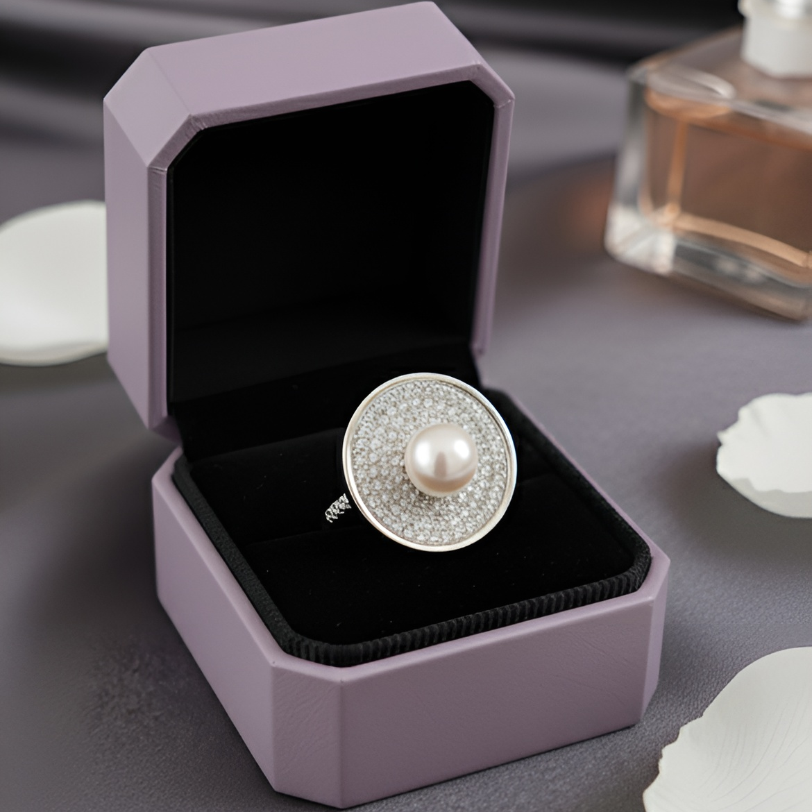 Inspired by the quiet brilliance of the ocean’s rarest jewel, Morvarid celebrates the eternal allure of pearls. Crafted in fine silver, this signature ring features a luminous central pearl set on a sculptural circular base — bold yet serene, radiant yet composed.